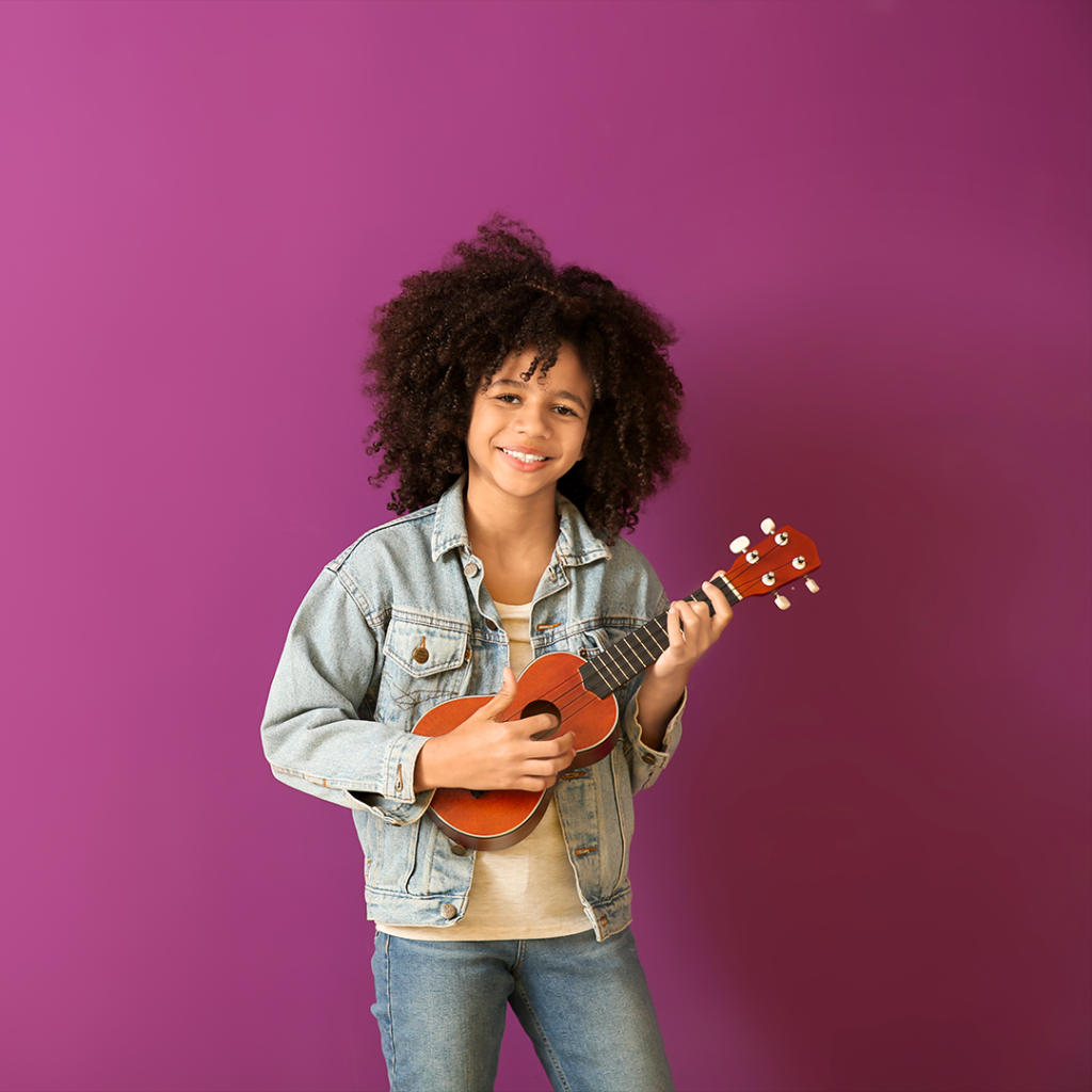 Girl playing ukulele.